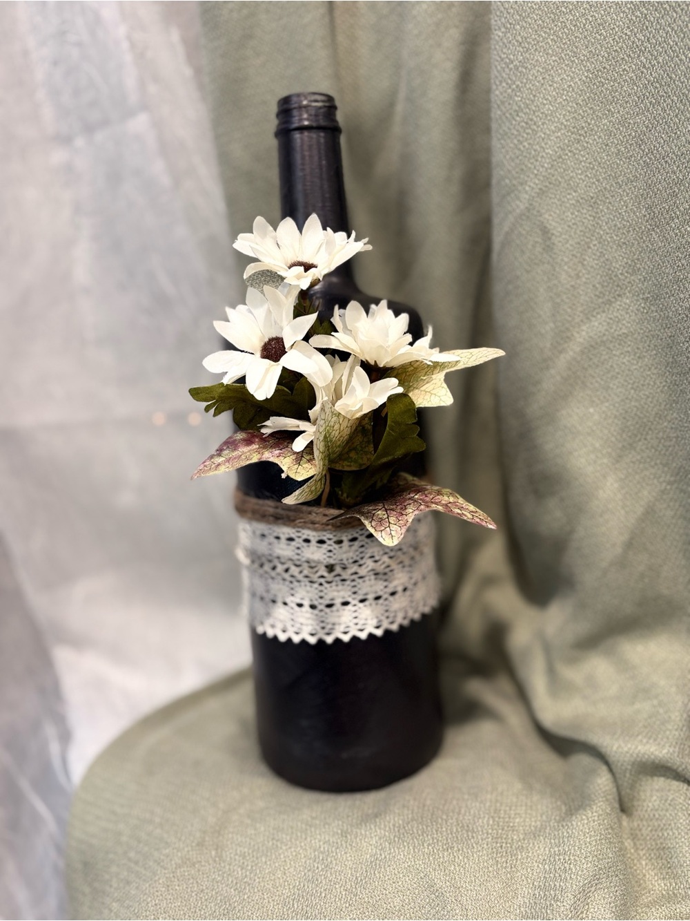 Handcrafted Black Bottle Vase with White Daisies and Lace Accent
